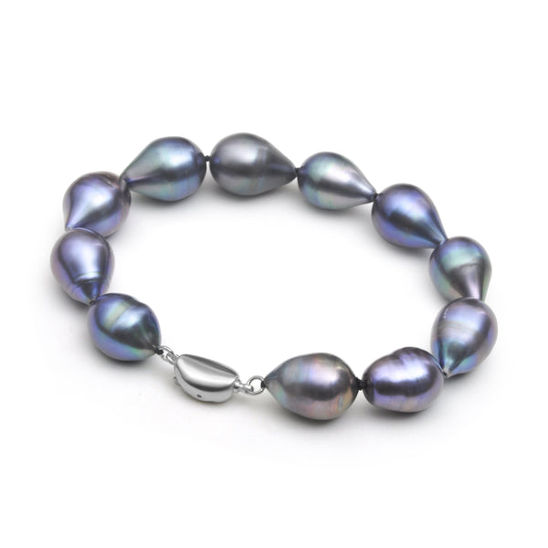 Bracelet riviera tour de poignet de 19cm et 20cm avec des perles de culture d’eau douce noires de forme olives de 11mm, et fermoir 925